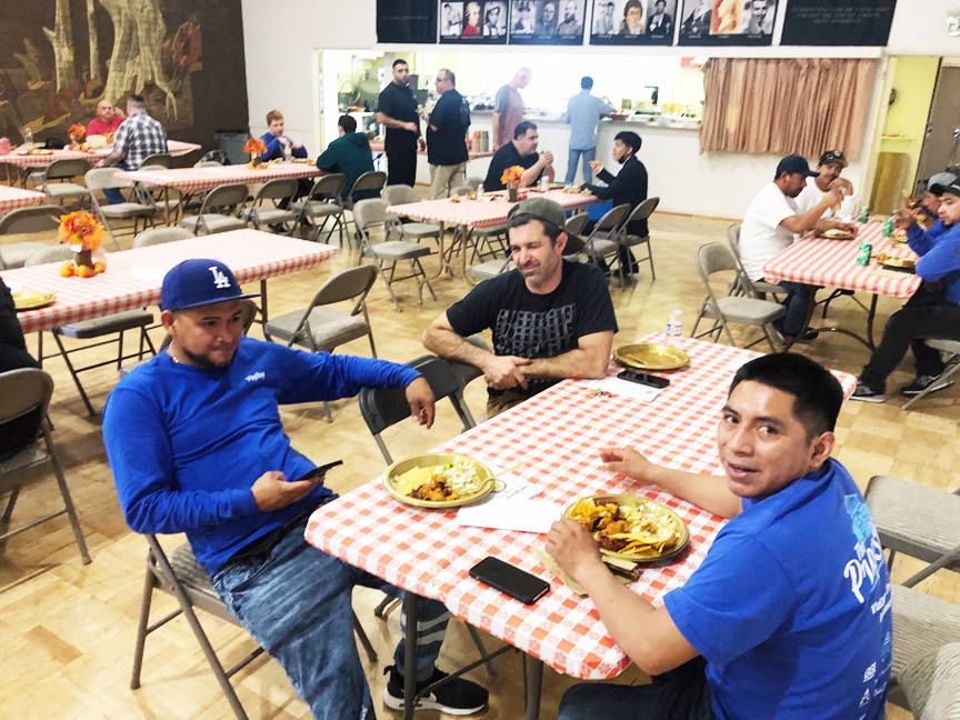 people sitting at tables i banquet hall