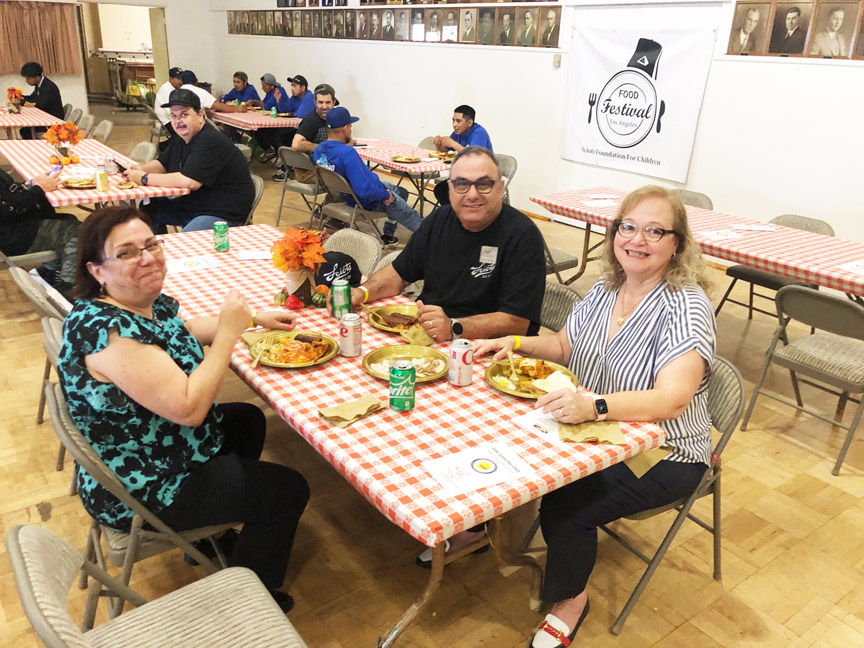 Rastamian family eating at table