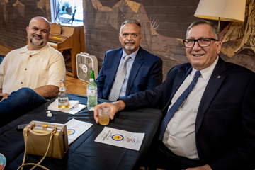 3 guys at their table, pre dinner