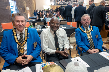 3 dignitaries at a table