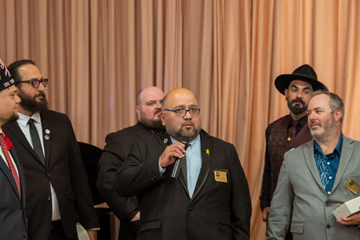 another recipient speaking into mic