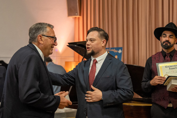 Toparch presenting an award