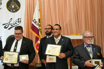 4 recipients holding their awards