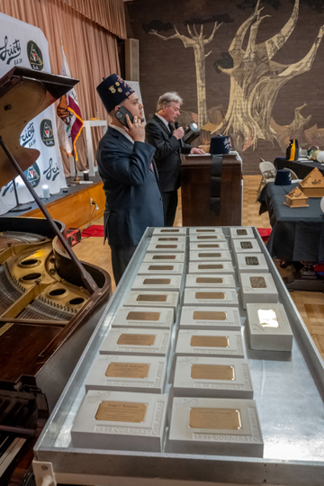 awards table before giving them out, Ron Perez on the mic