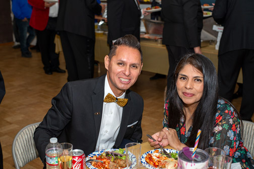 good looking couple sitting at table