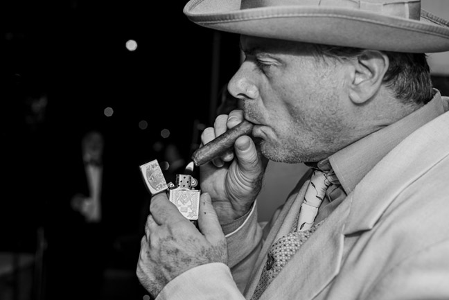 Frank Barbano lighting a cigar
