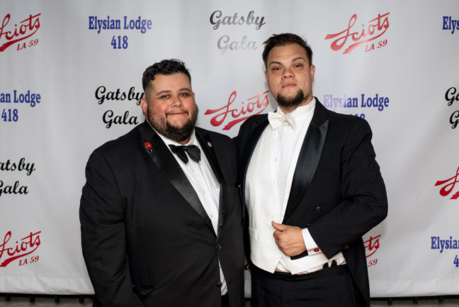 Gallen Hernandez and Ron Perez at the step and repeat backdrop
