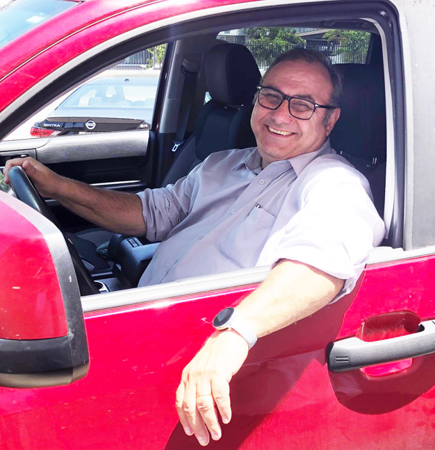 Harry Rastamian in his truck with a big smile