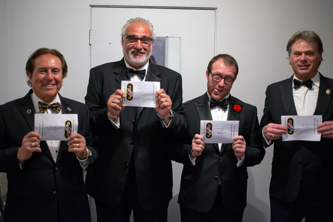Irv, seb, mike, frank holding up papers