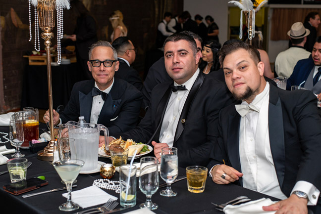 banquet table with 3 guys