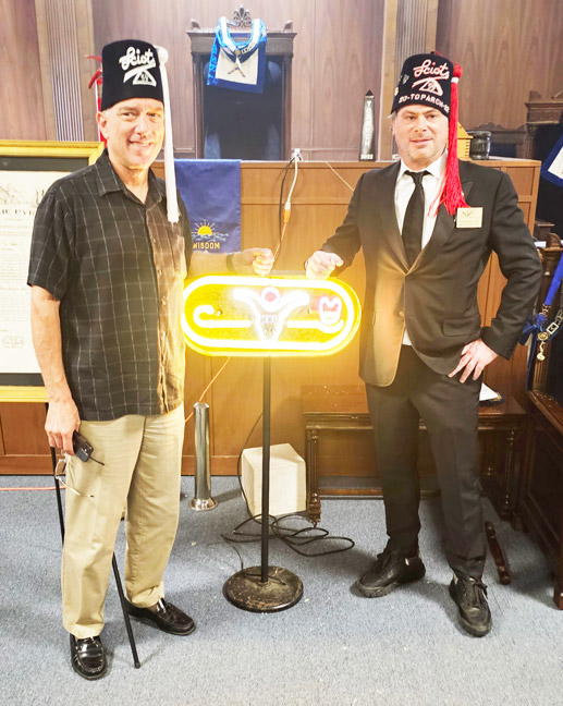 Rite Worshipful G. Sean Metroka with Frank Barbno next to Sciots light in Lodge room